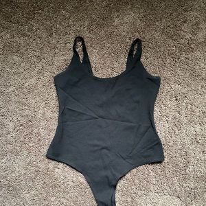 Black button clasp body suit